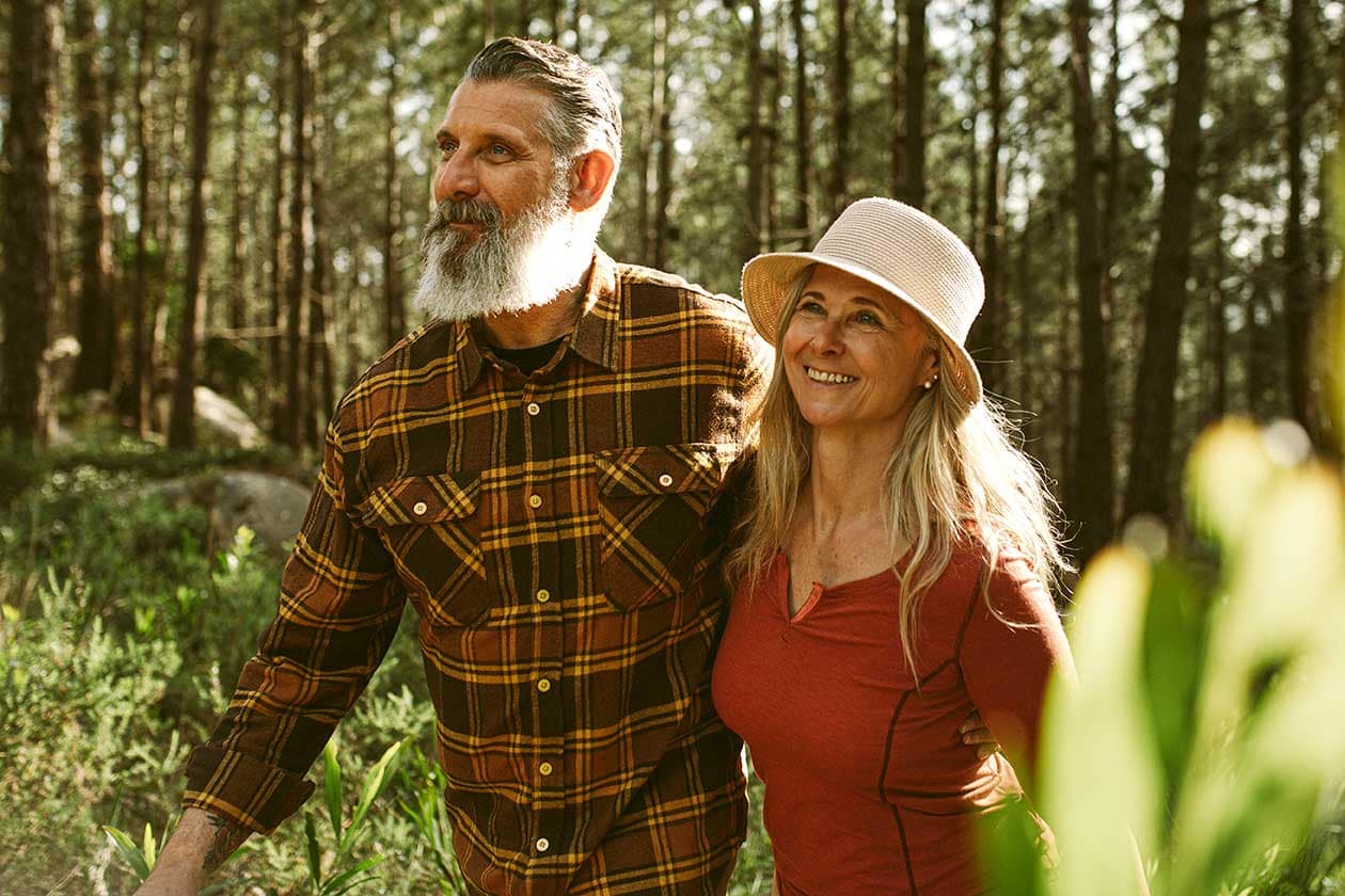 Happy Couple Hiking in a Forest